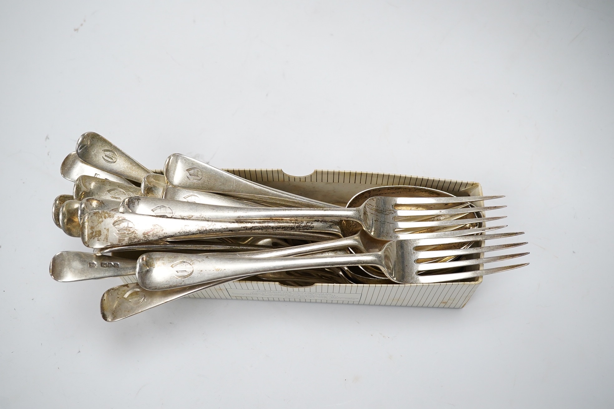 A twenty two piece part canteen of George V silver old English pattern cutlery, Josiah Williams & Co, London, 1910, 44.7oz. Condition - poor to fair